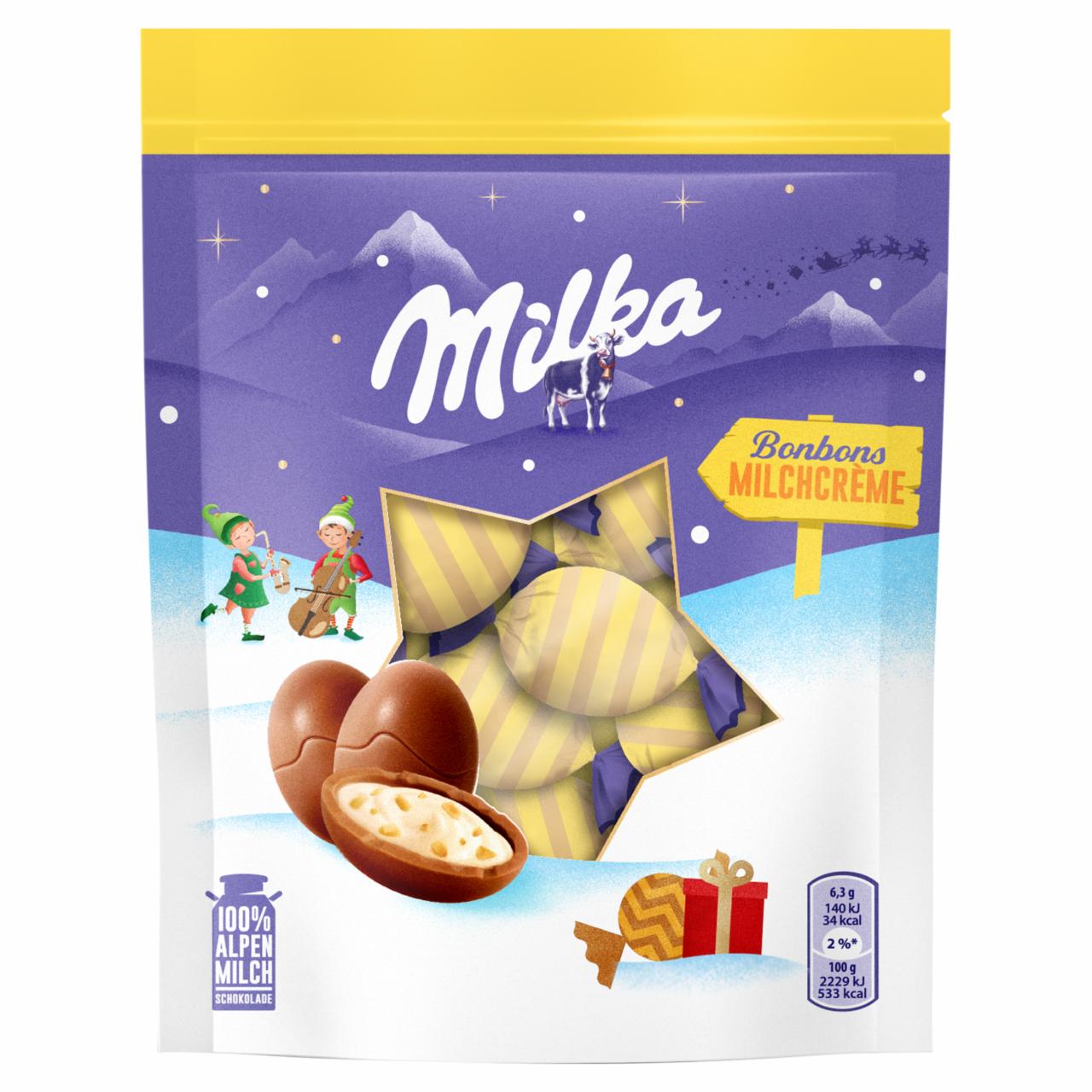 Zdjęcia - Milka Czekolada mleczna z nadzieniem mlecznym i kawałkami orzechów laskowych 86 g (14 sztuk)