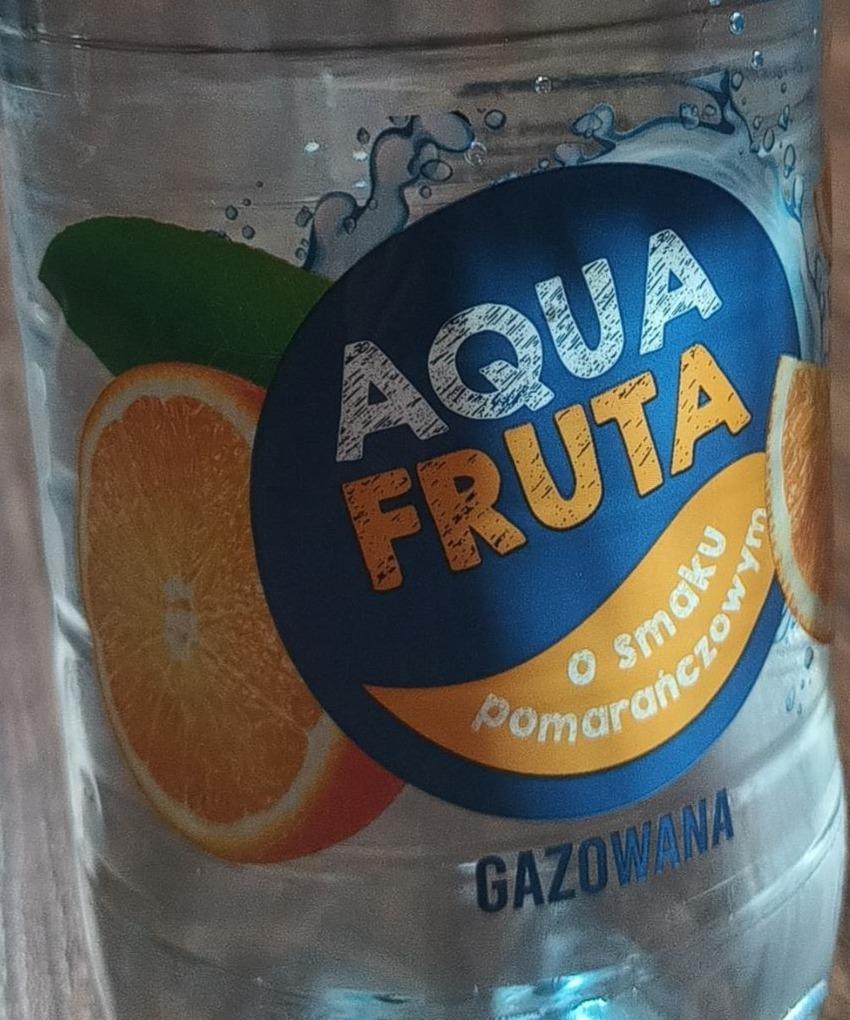 Zdjęcia - Woda gazowana o smaku pomarańczowym Aqua Fruta