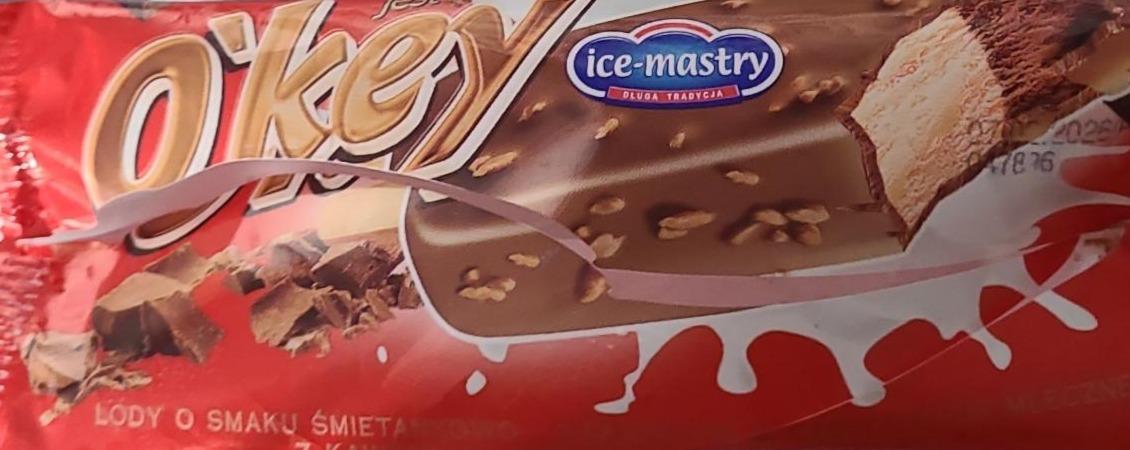 Zdjęcia - O'key lody o smaku śmietankowo kakaowym w czekoladzie mlecznej z kawałkami orzechów arachidowych Ice-mastry